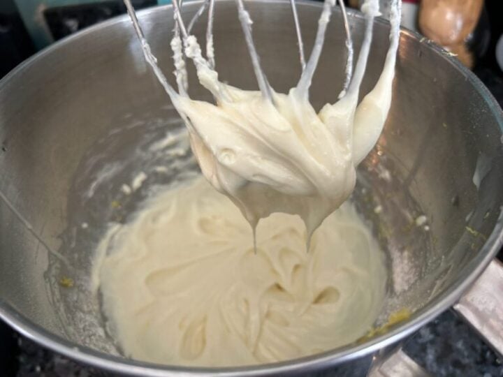 cheesecake filling in mixing bowl with whisk