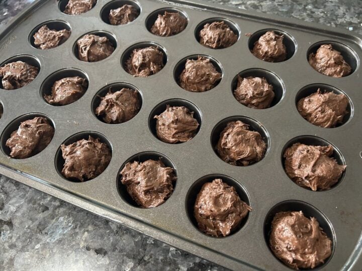 brownie batter in muffin pan