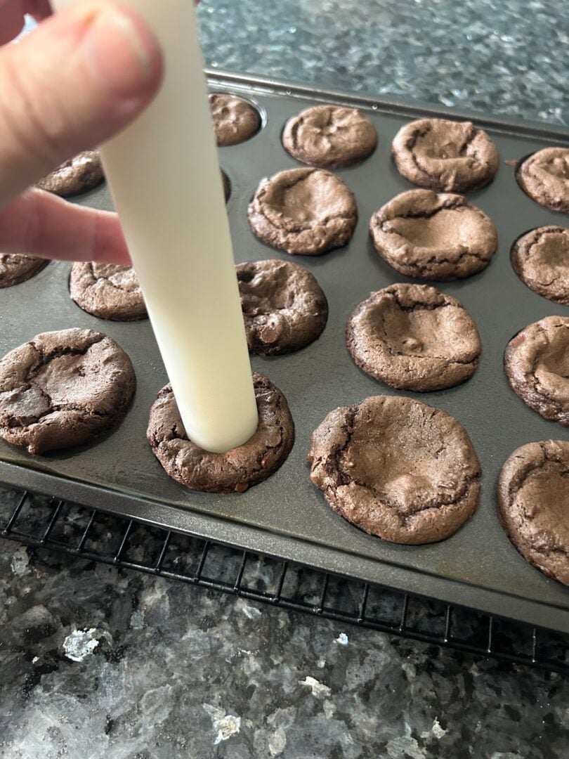 pressing holes into brownie bites
