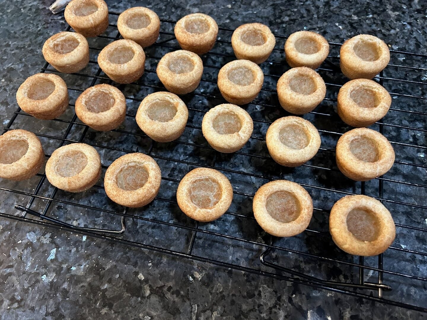 snickerdoodle shells on wire rack to cool