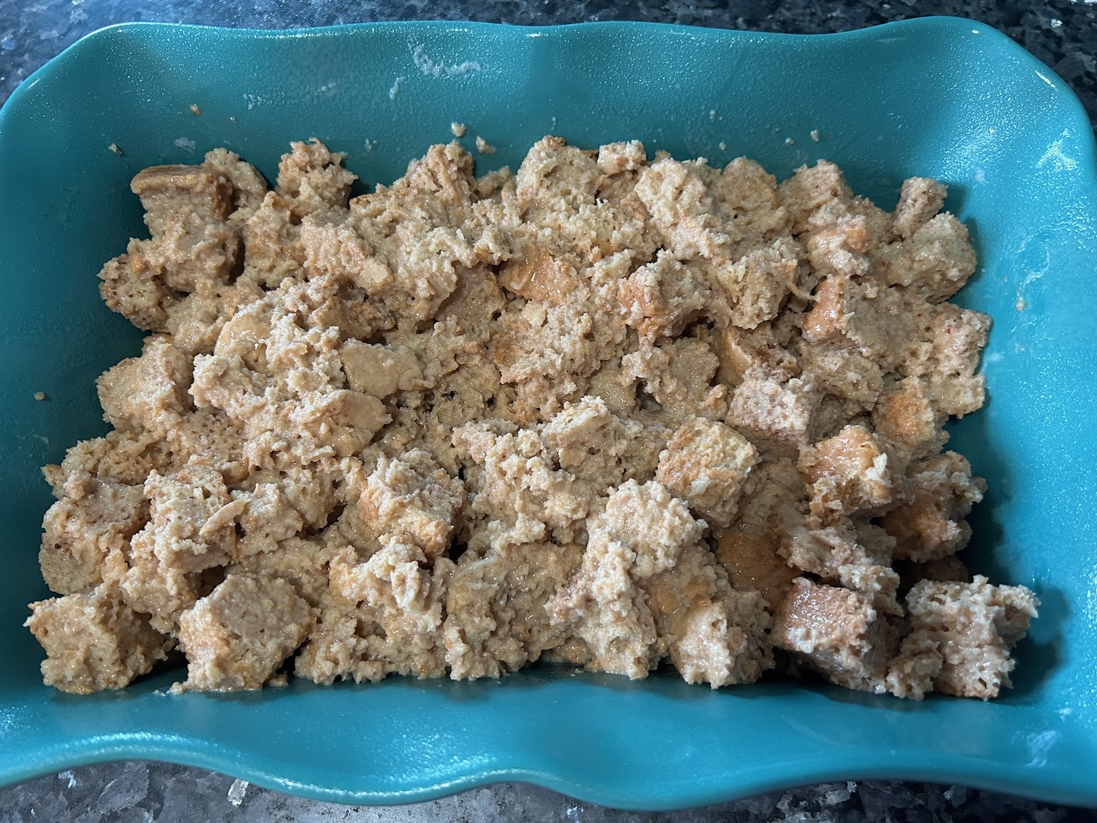 soaked cubed bread in baking dish