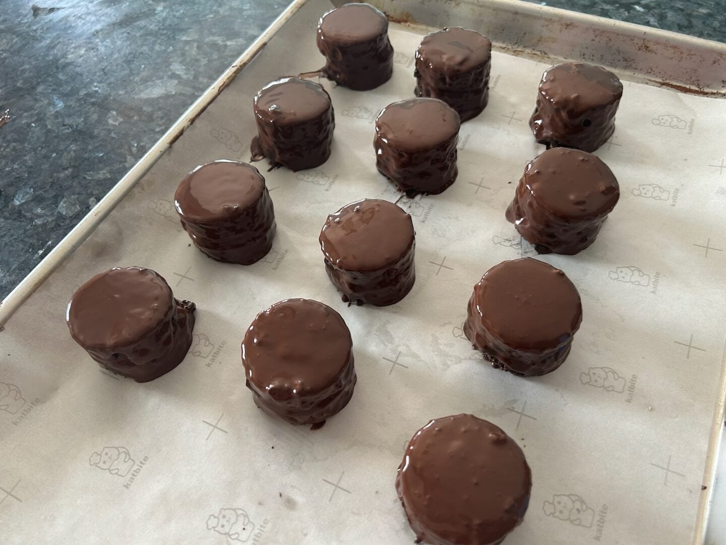 petit fours on sheet pan after dipping