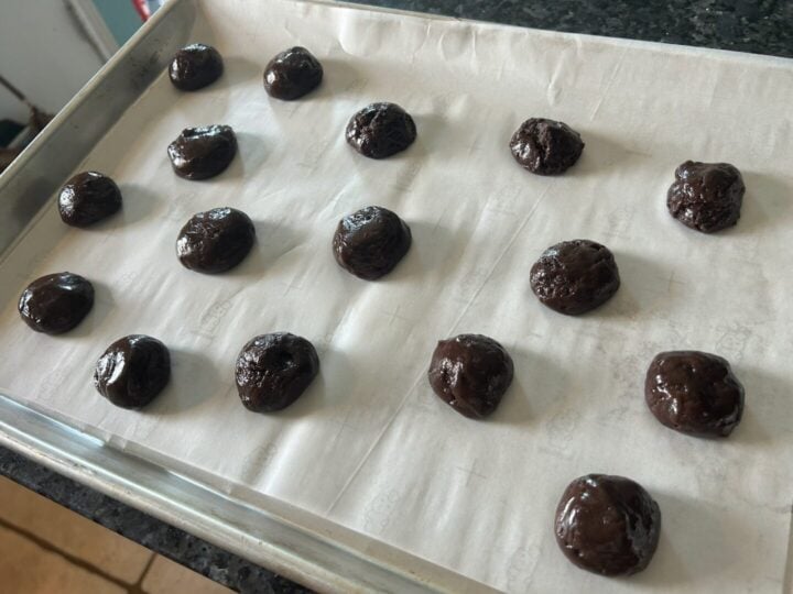 cookie dough balls on baking sheet