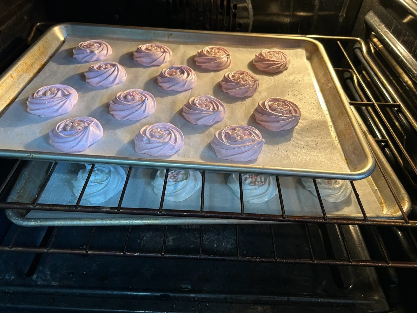 meringue rosettes baking in oven