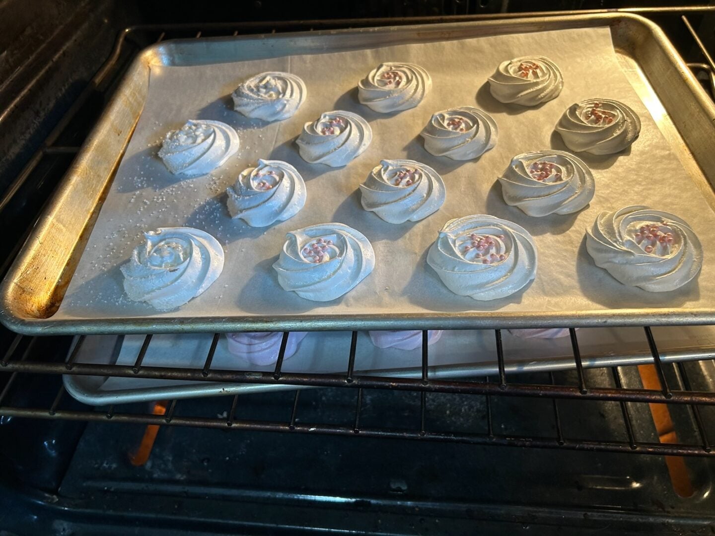 meringue rosettes baking in oven
