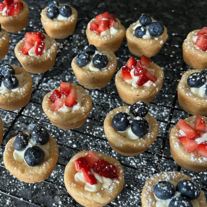 mini cheesecake cookie cups dusted with powdered sugar