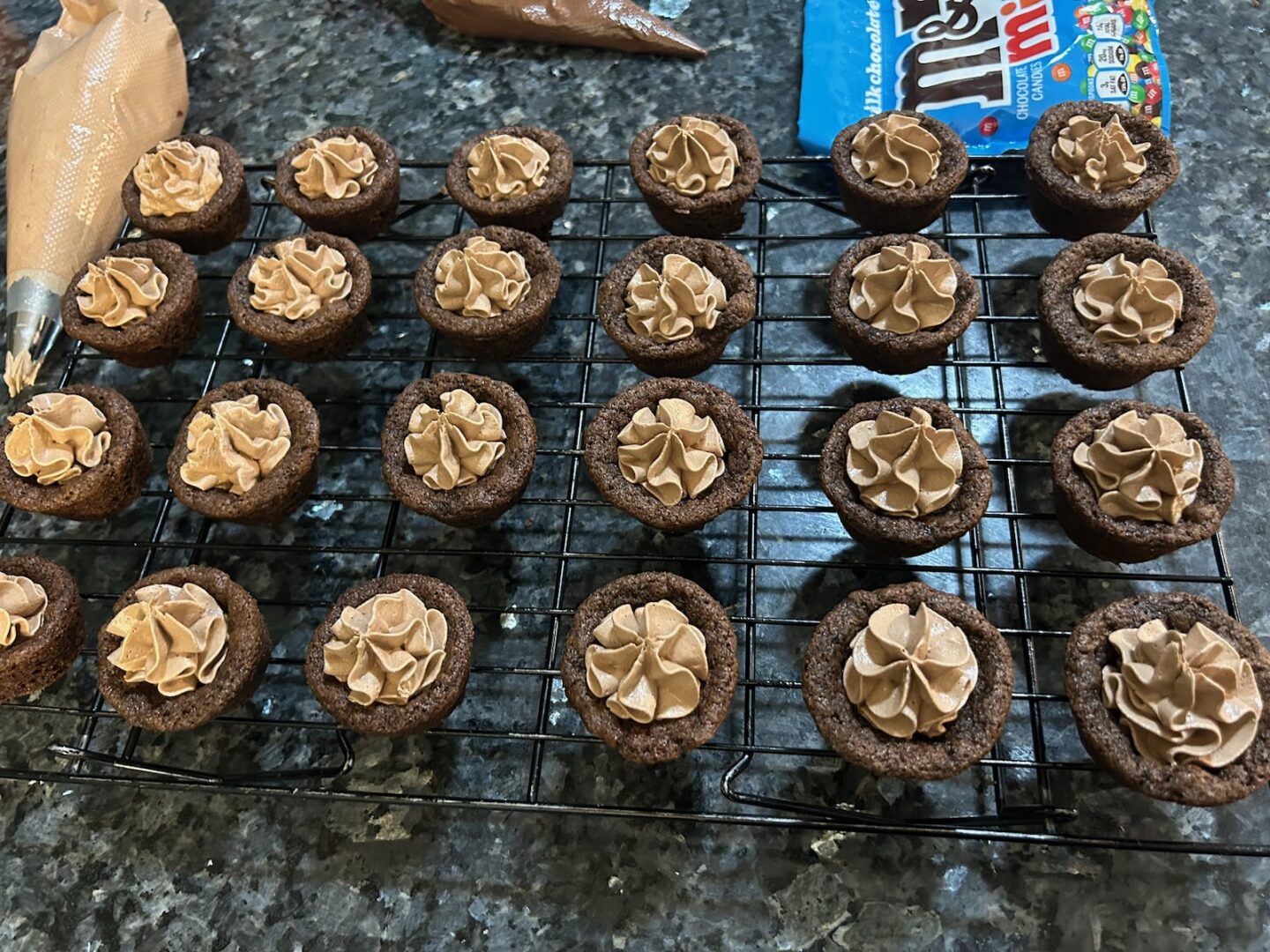 chocolate cookie cups filled with chocolate marshmallow fluff frosting