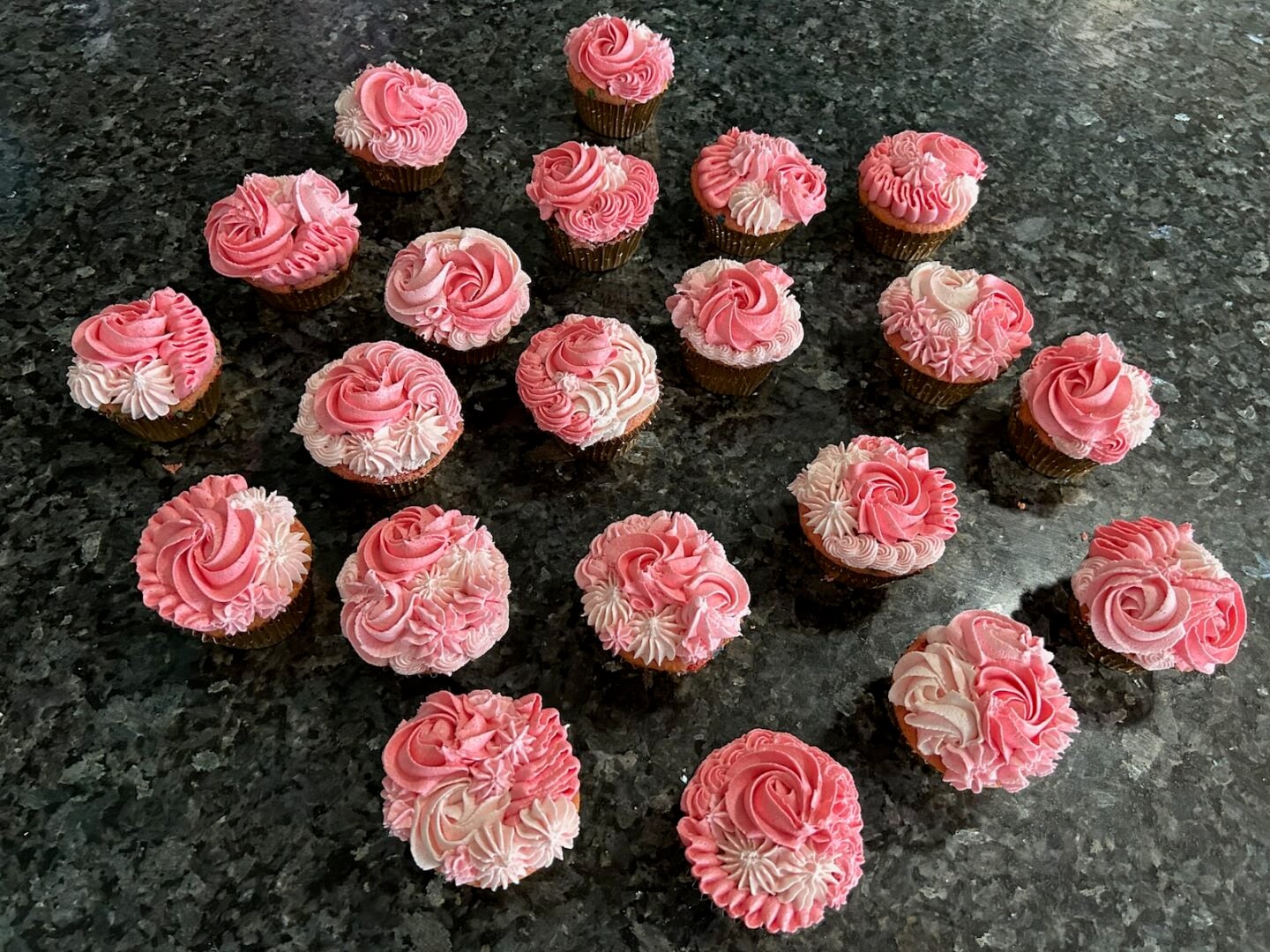 pink ombre cupcakes piped with a variety of tips: rosettes, ruffles, and puffs