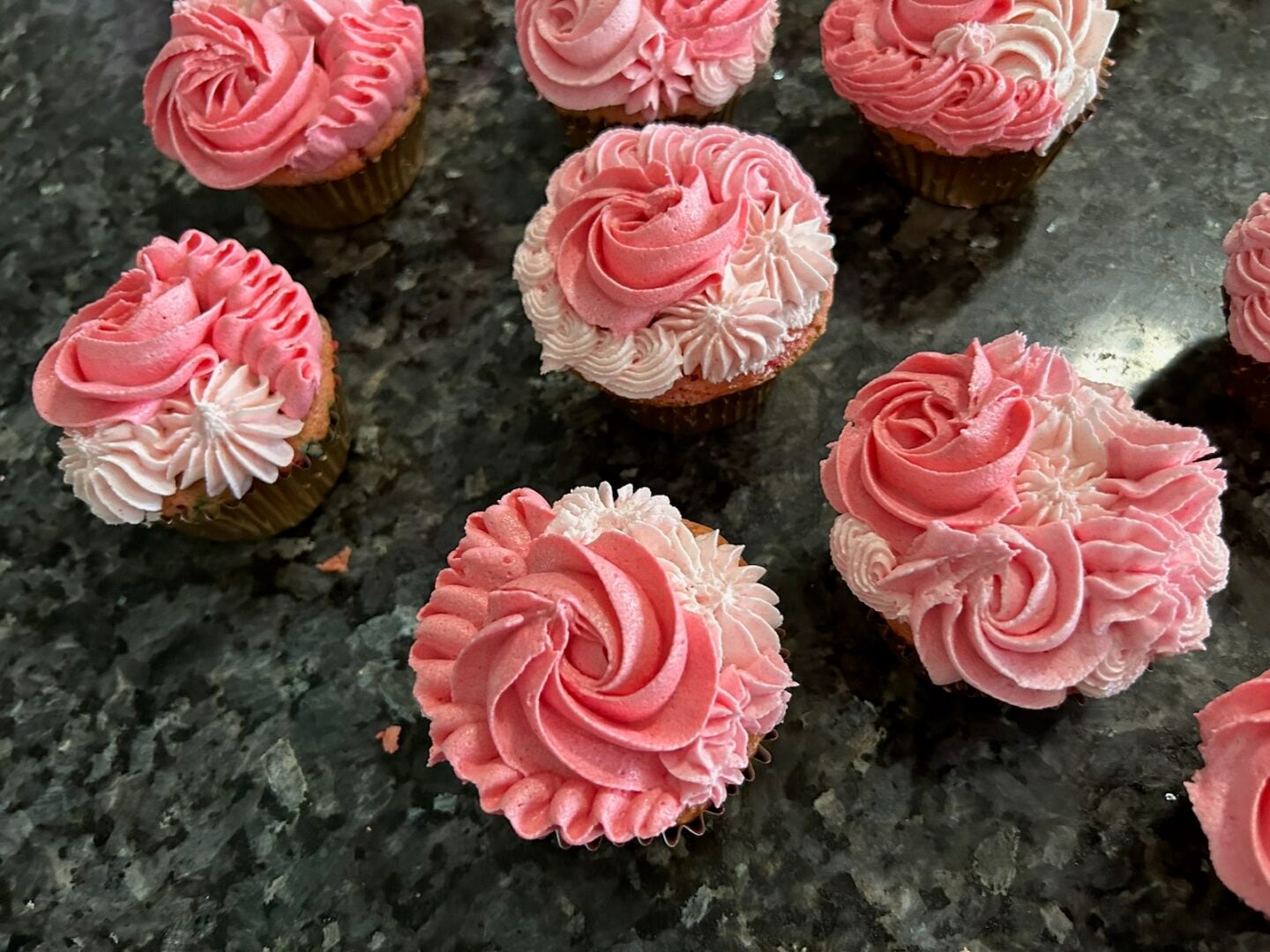 pink ombre cupcakes piped with a variety of tips: rosettes, ruffles, and puffs