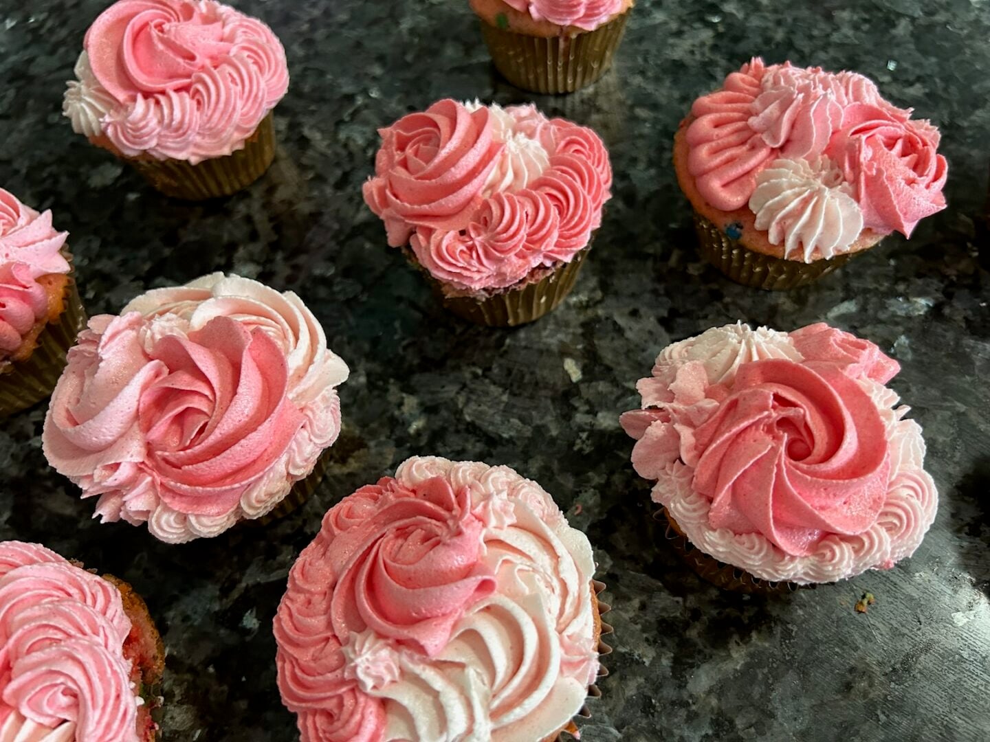pink ombre cupcakes piped with a variety of tips: rosettes, ruffles, and puffs