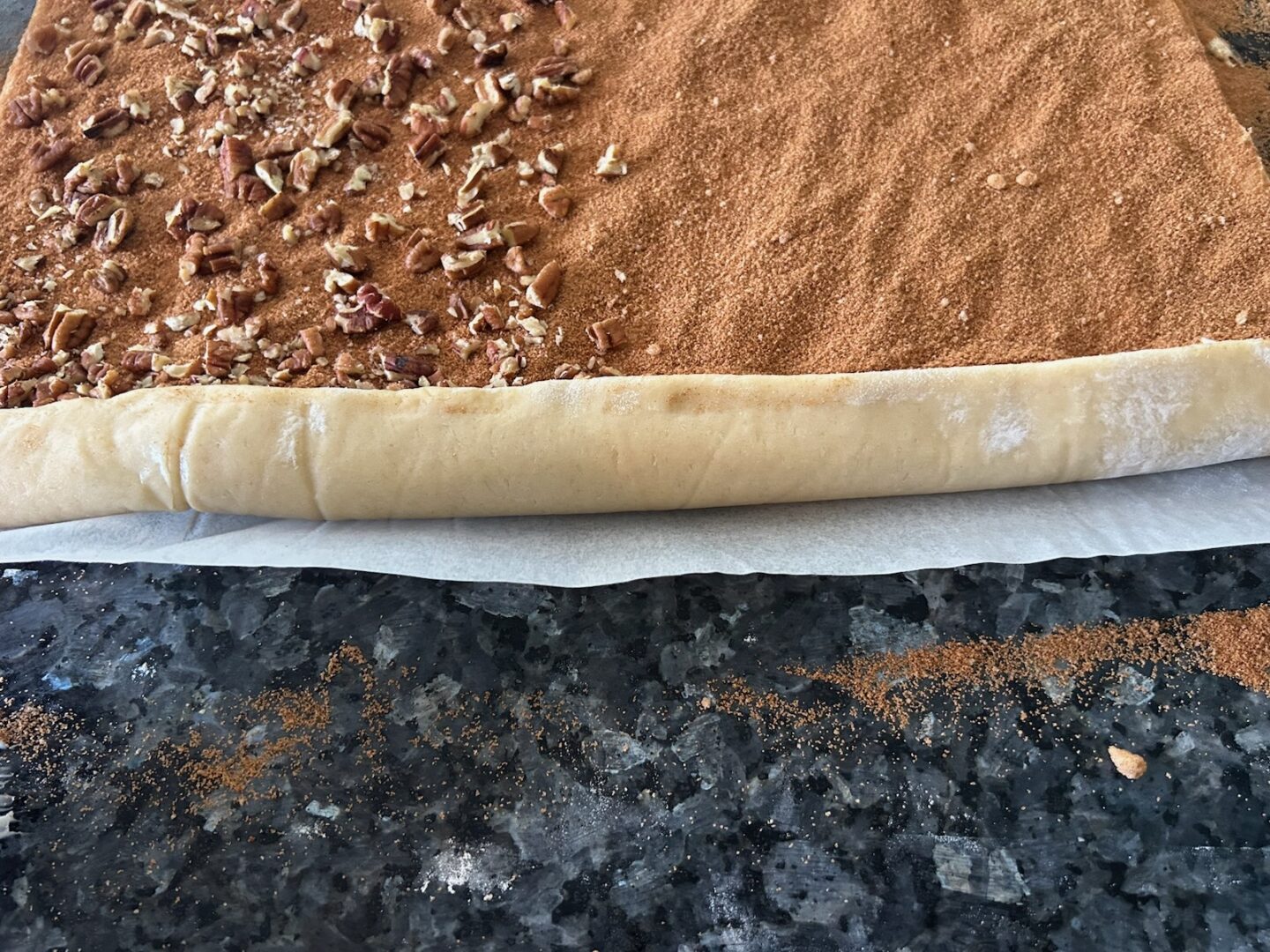 rolling the cinnamon rolls