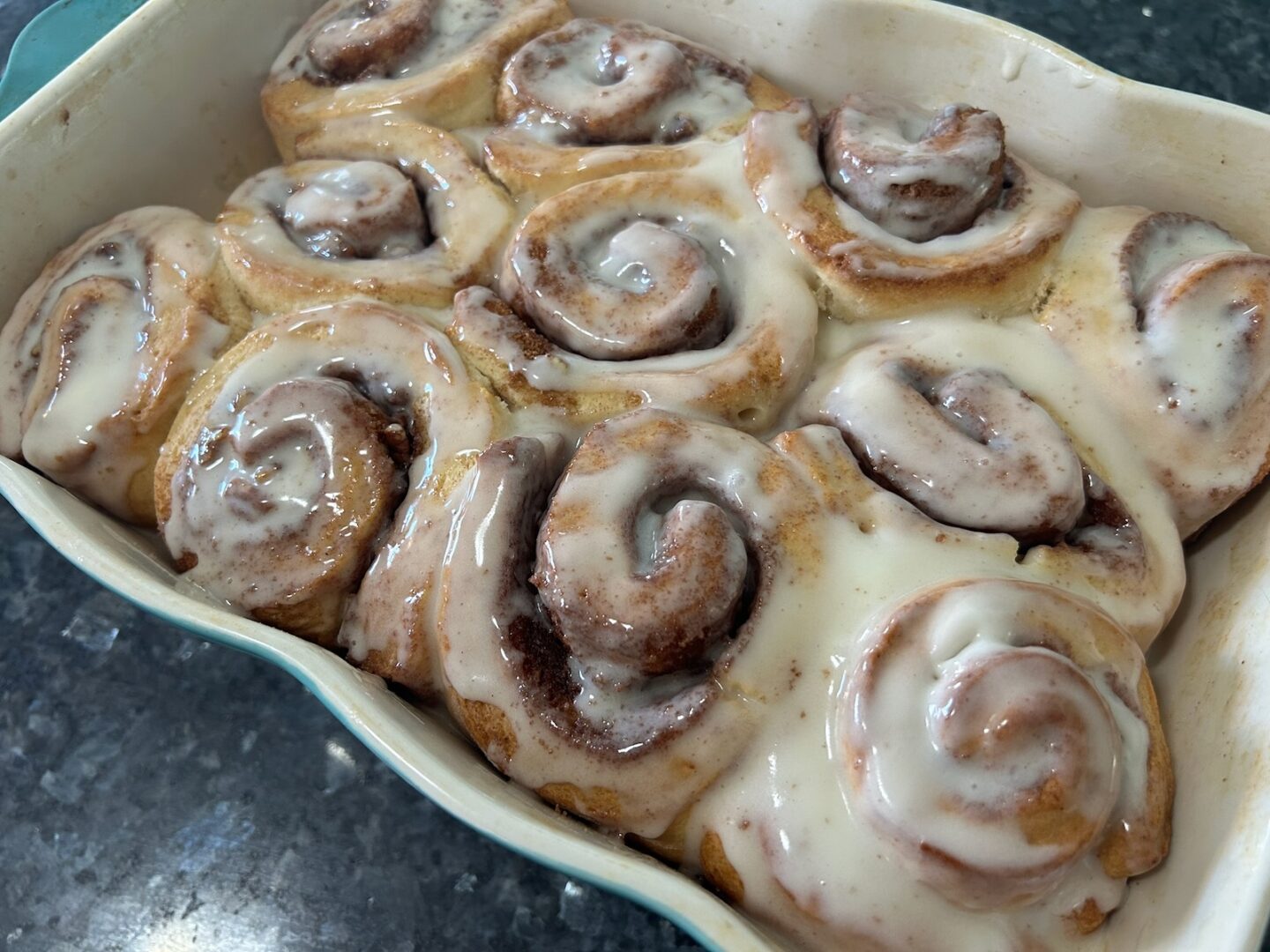 glazed cinnamon rolls in pan