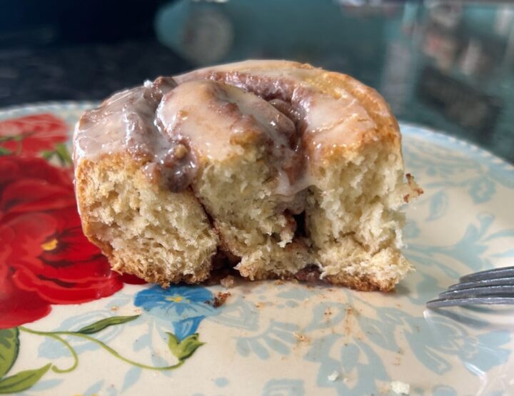 cake mix cinnamon roll cut in half interior exposed, light and fluffy with ribbons of cinnamon sugar