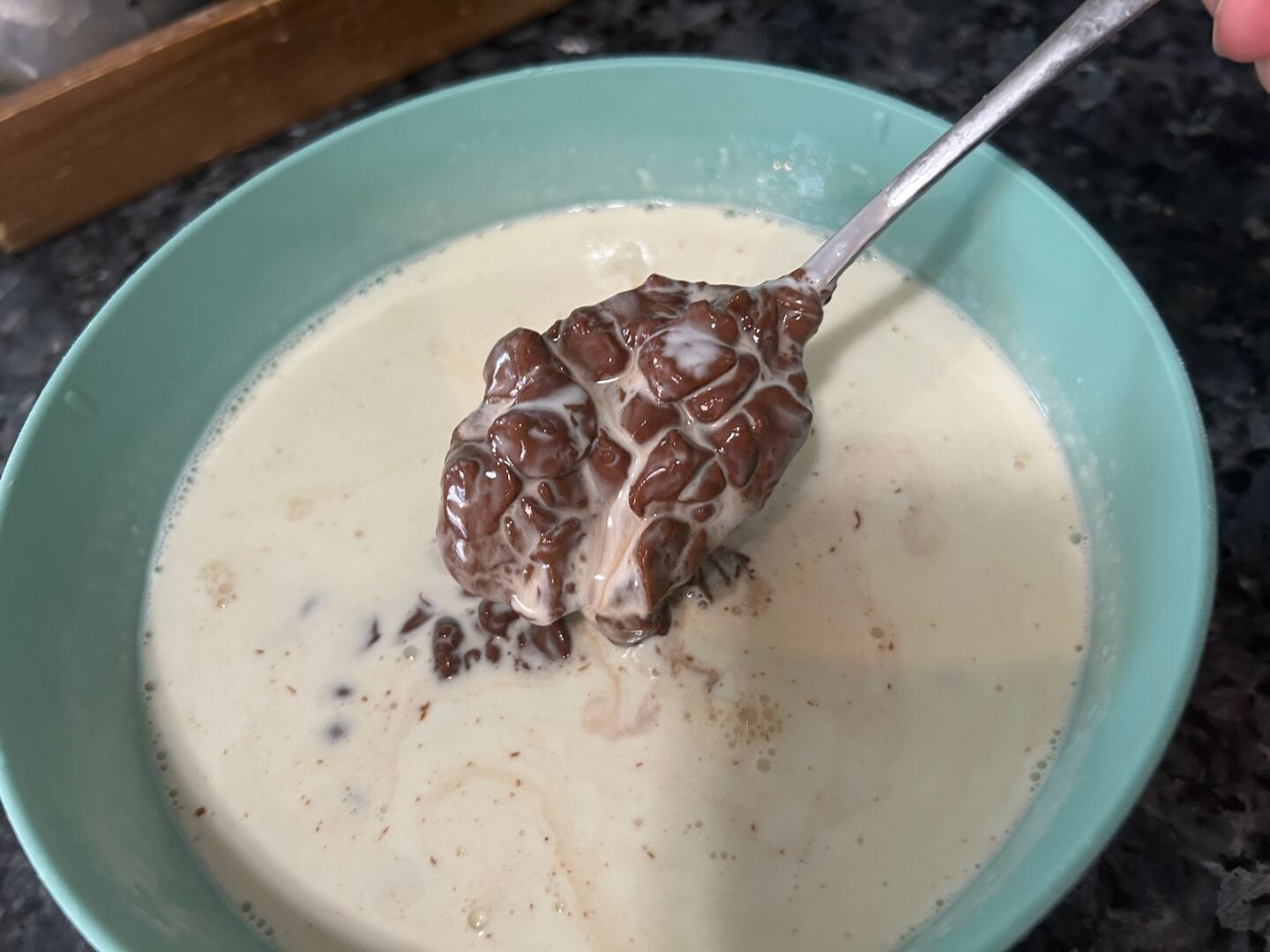 making chocolate ganache (chips and cream in bowl)
