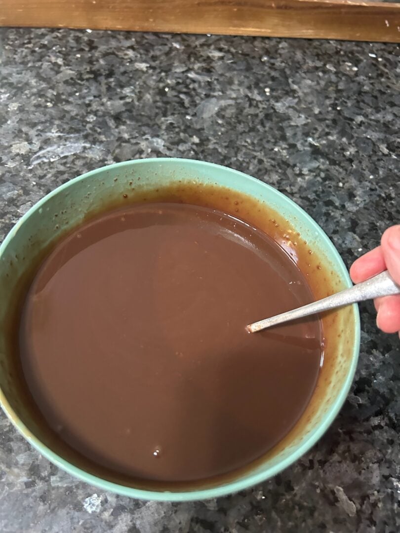 making chocolate ganache (chips and cream in bowl)
