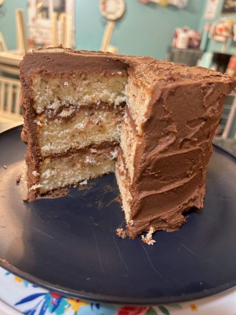 whipped chocolate ganache frosting on white layer cake