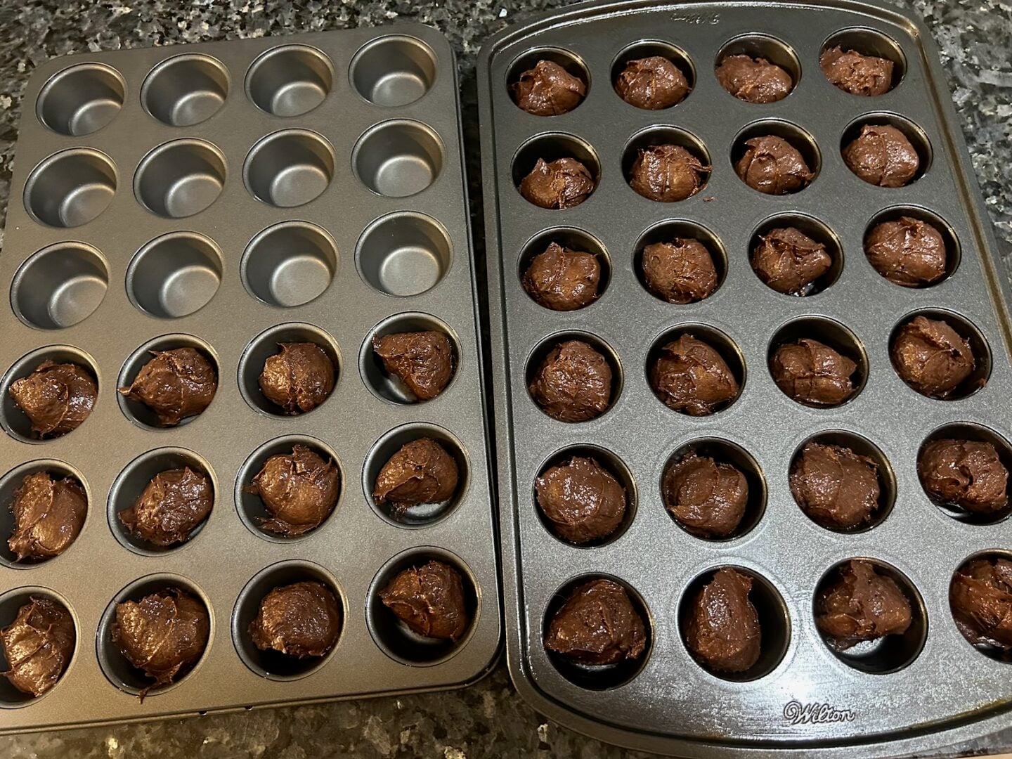 chocolate cake batter in muffin tin