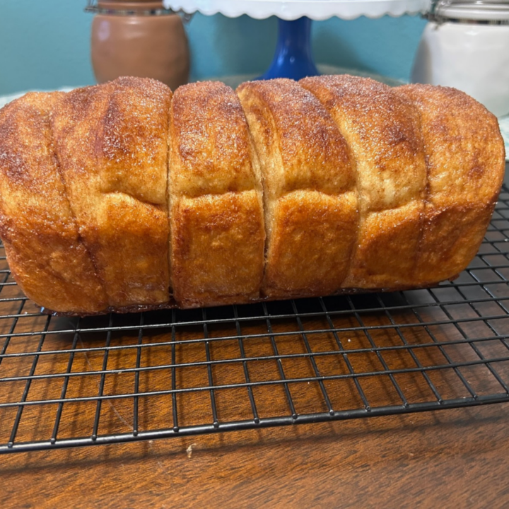 Easy Copycat Dollywood Cinnamon Bread pin with caramelized exterior