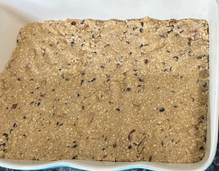 Easy Nutella Revel Bars oat mix in bottom of casserole dish