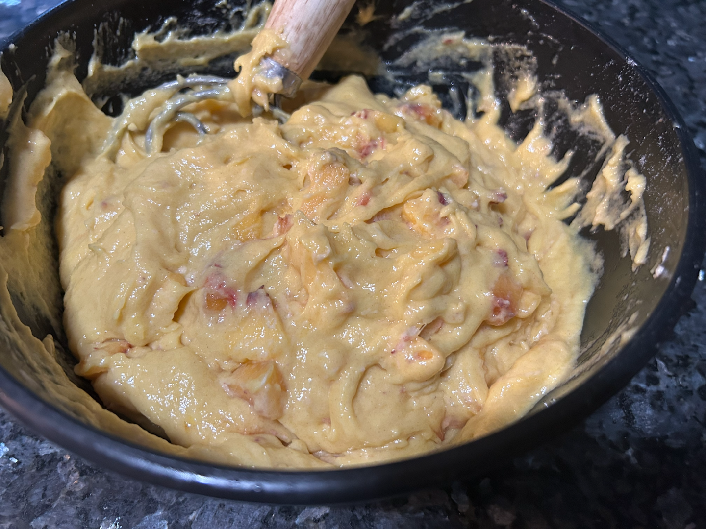 Easy Peach Coffee Cake batter in bowl, peaches added