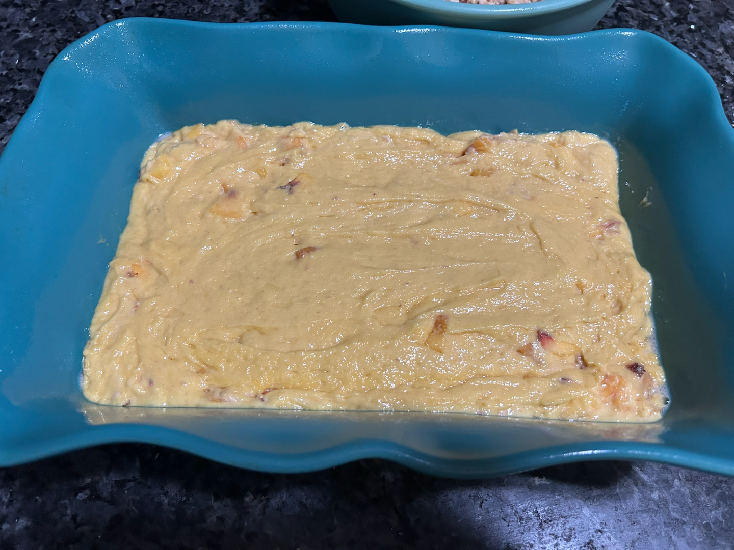 Easy Peach Coffee Cake batter in casserole dish