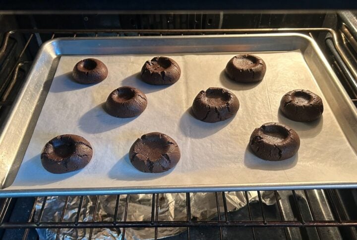 Dolly Parton Chocolate Thumbprint Cookies in oven baking