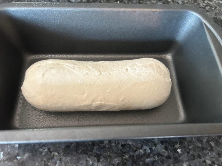 frozen loaf of white bread dough in loaf pan