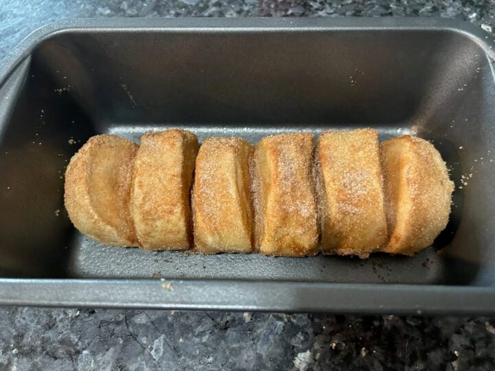 prepped cinnamon sugar bread dough in loaf pan ready to rise