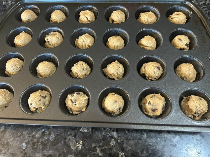 2-ingredient Reese's chocolate chip cookie cups dough balls in mini muffin tin