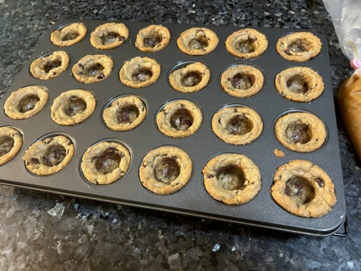 Easy Salted Caramel Chocolate Chip Cookie Cups welled out