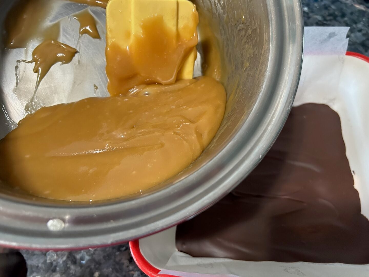 pouring caramel over chocolate