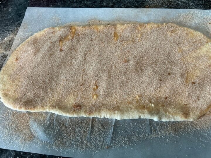 bread dough with cinnamon sugar on top