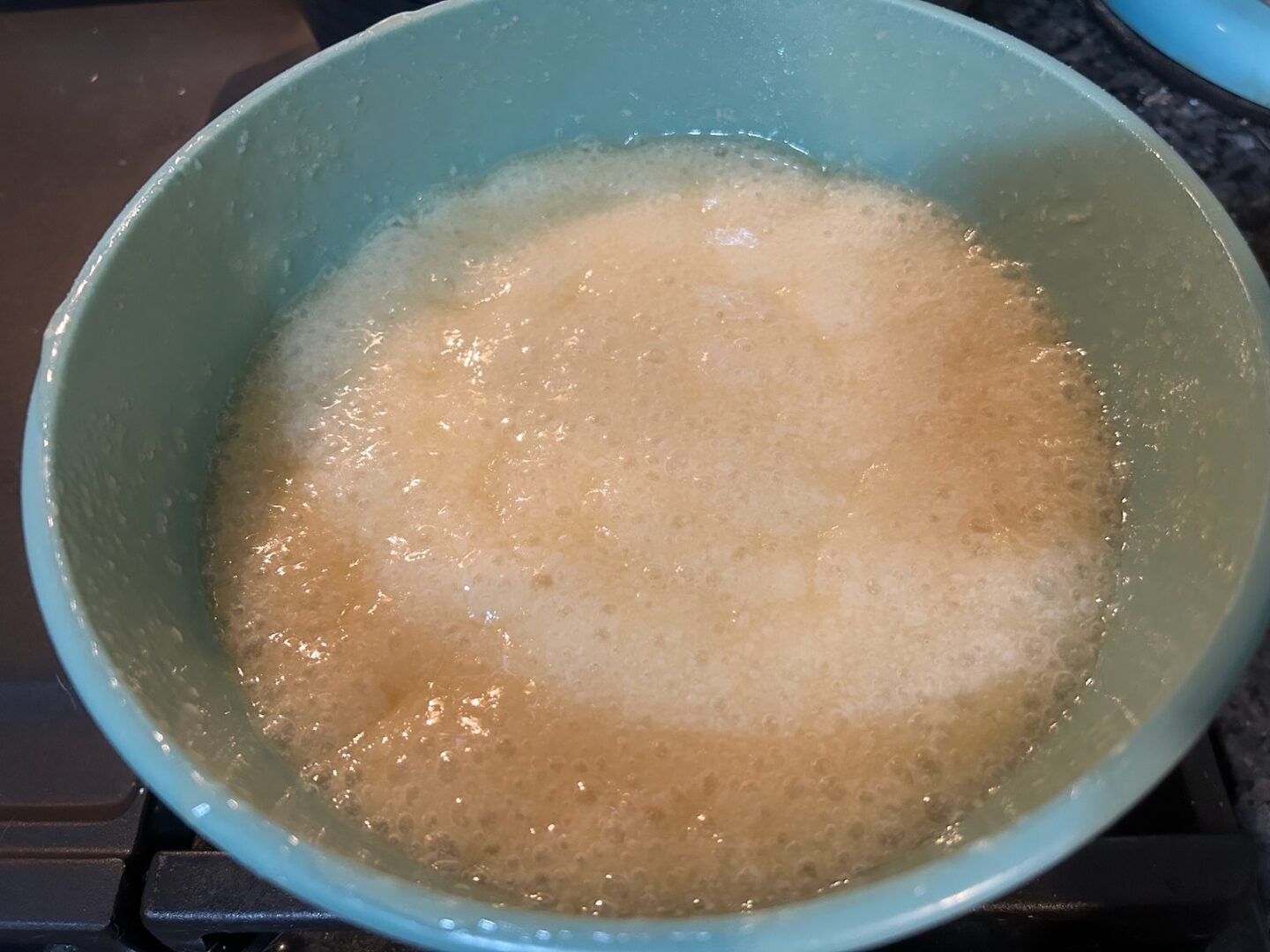 sugar, butter, and milk in bowl, boiling