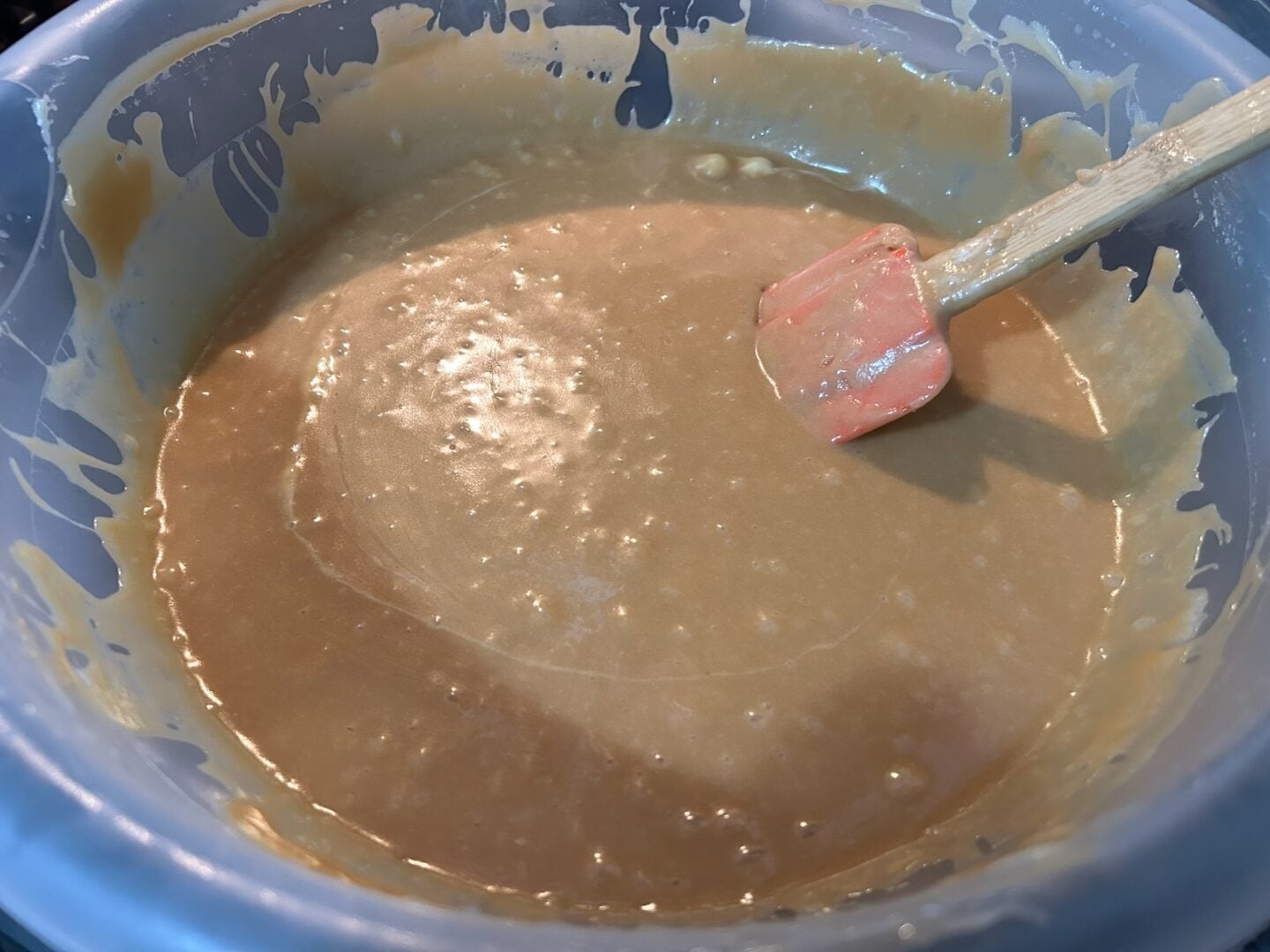 easy butterscotch walnut fudge in bowl, melted