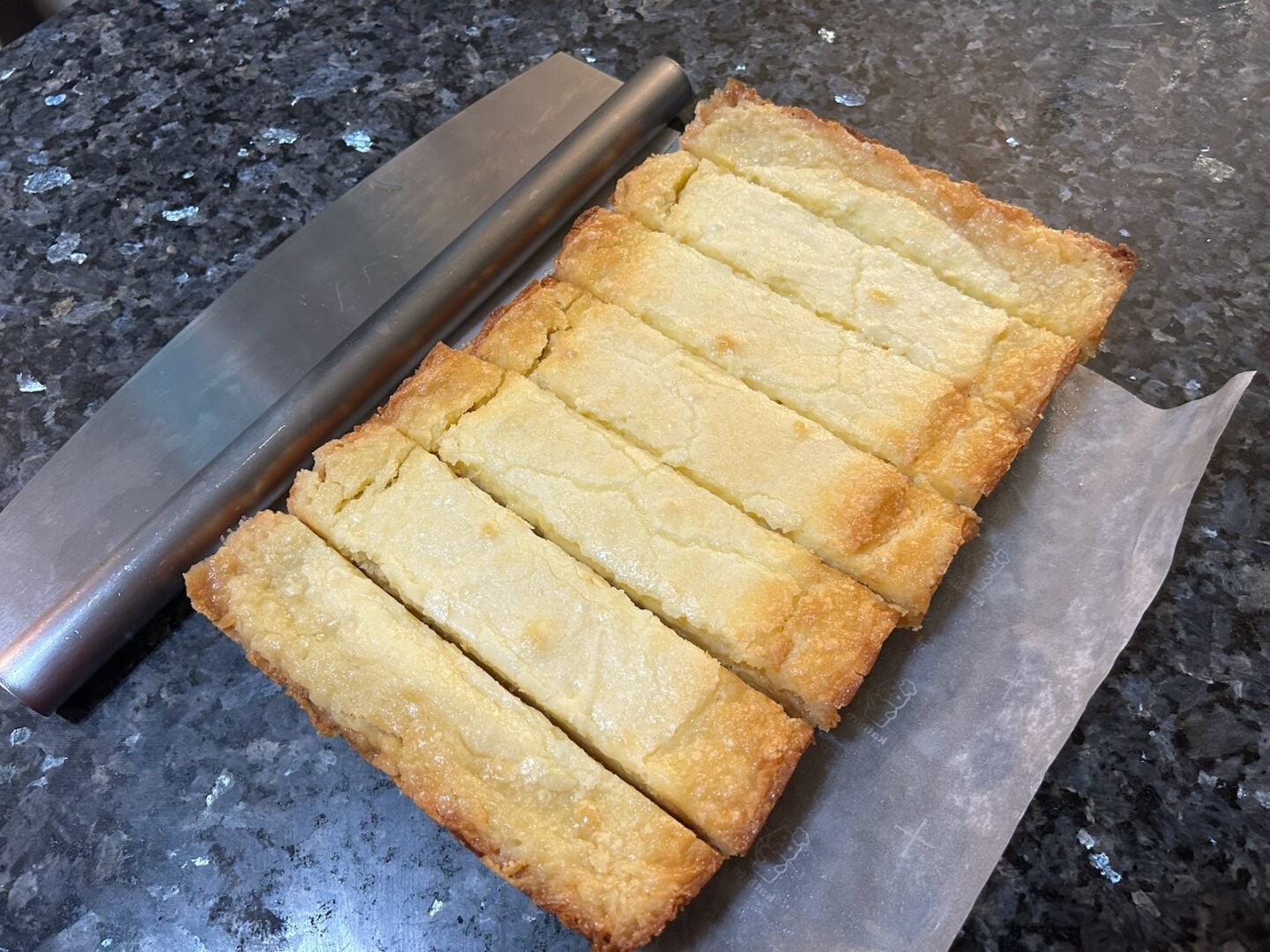 Lemon gooey butter cake sliced
