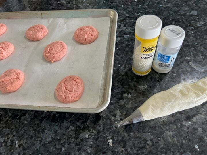 strawberry cake mix whoopie pies ready to be put together with buttercream