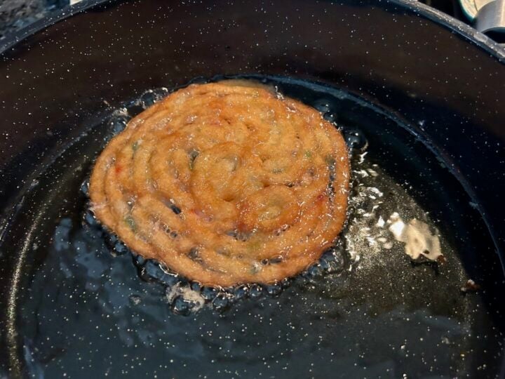 funnel cake frying in skillet
