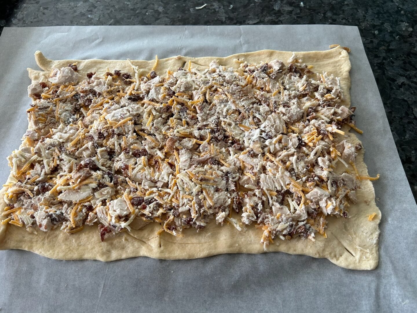 crescent rolls with filling on top