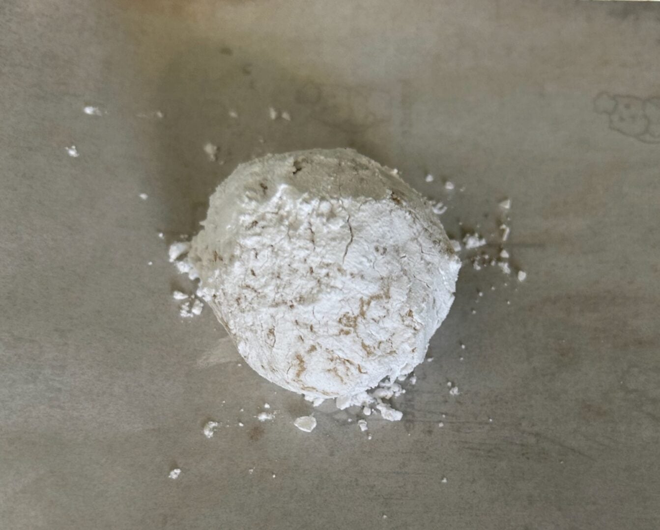 cookie dough ball rolled in powdered sugar