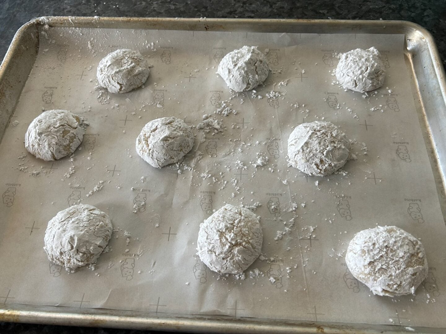 cookie dough balls on cookie sheet