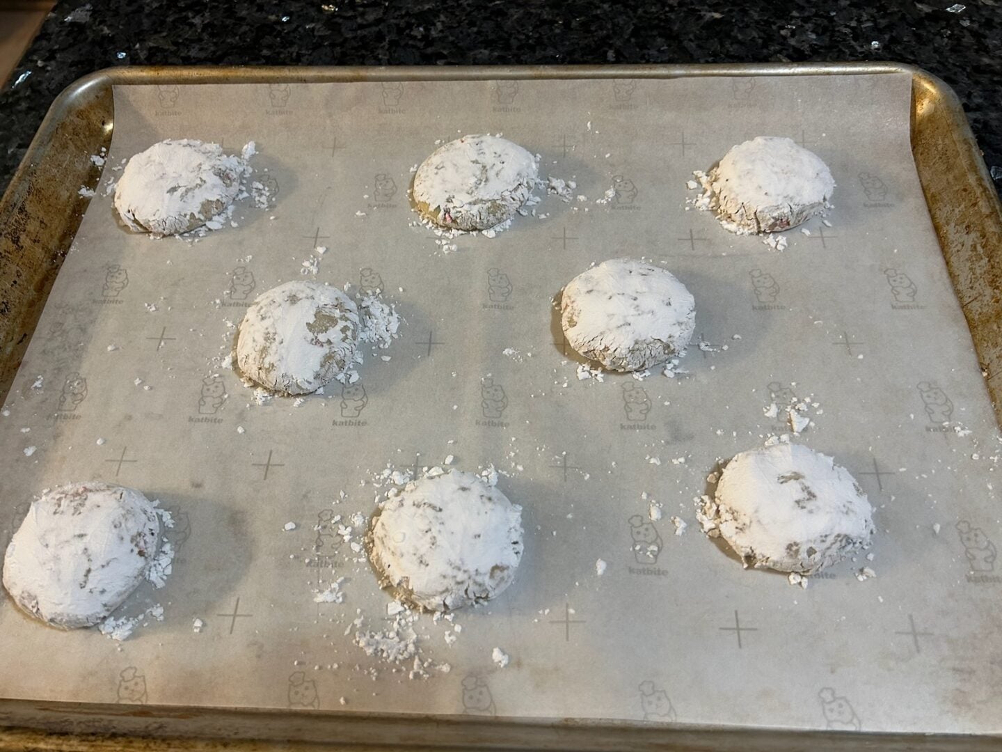cookie dough balls covered in powdered sugar