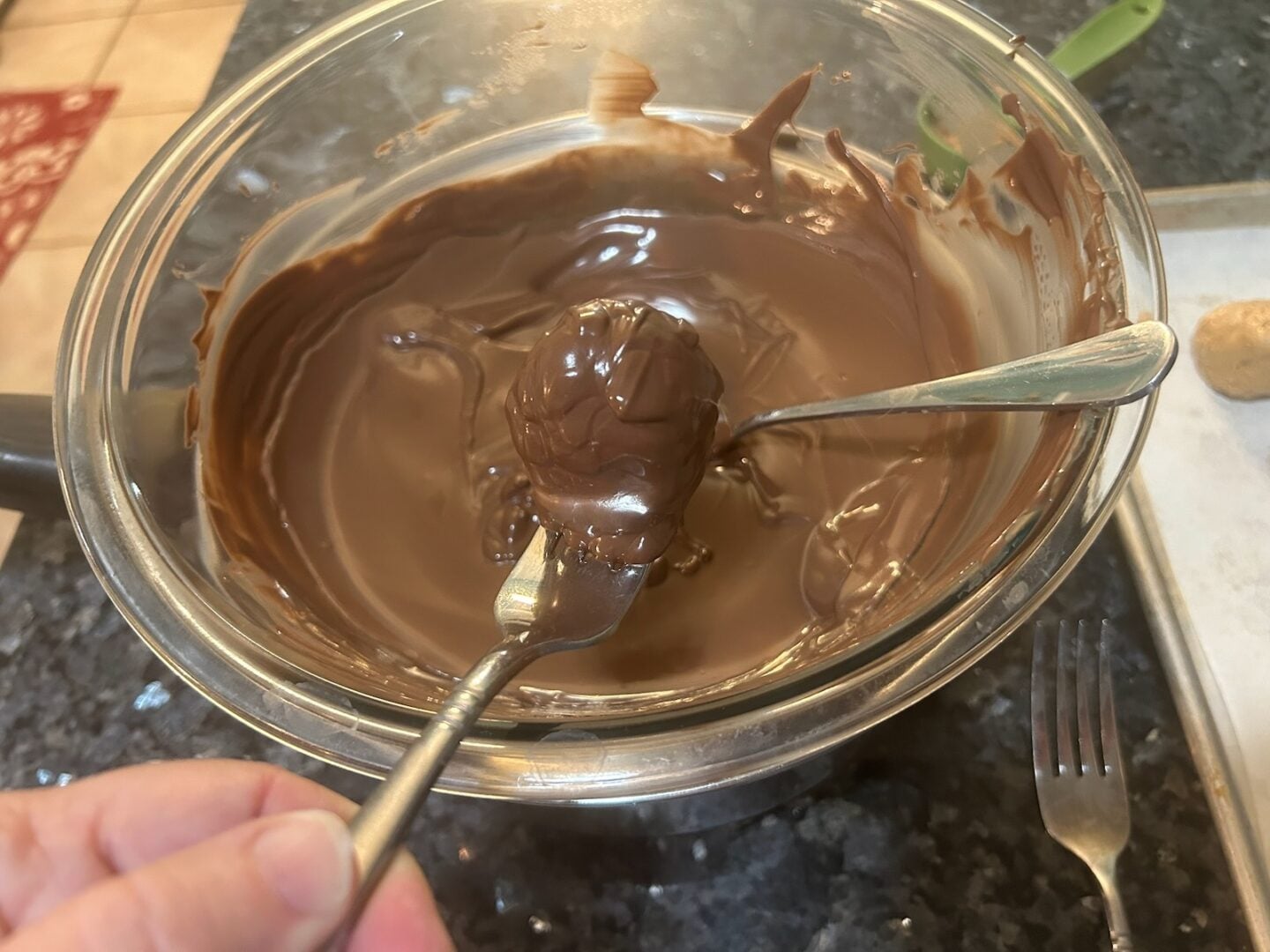 dipping truffles in melted chocolate